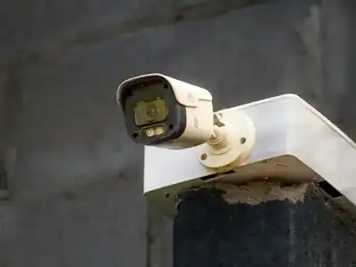Outdoor security camera mounted on a wall