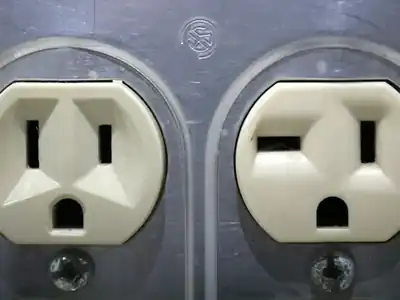 Close-up of two older outlets