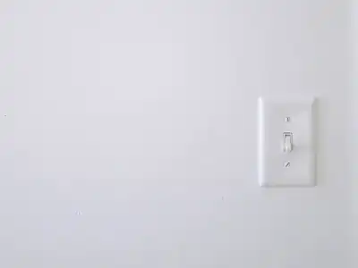 Toggle light switch on a wall